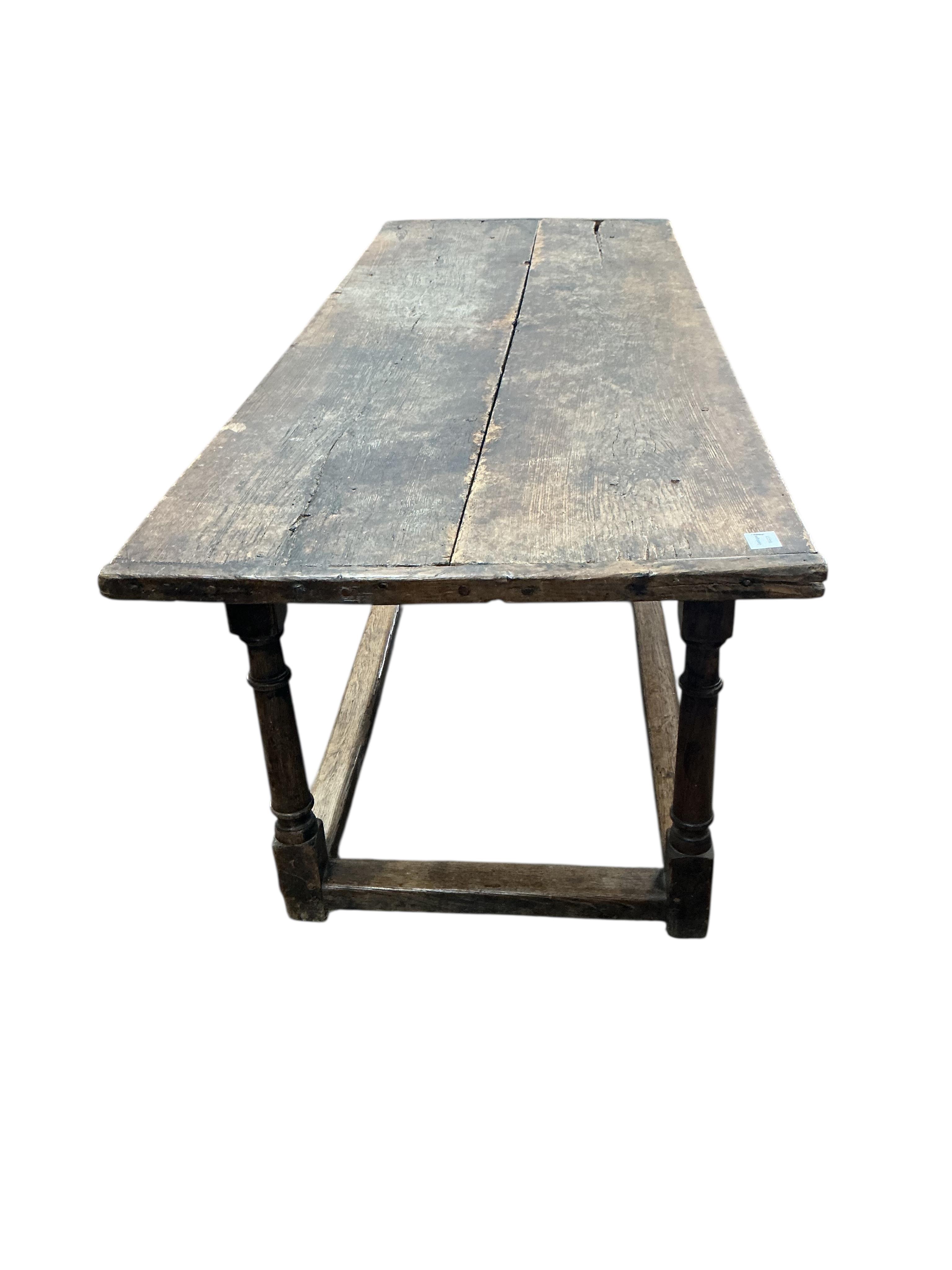 A 17th century and later rectangular oak refectory dining table, width 212cm, depth 75cm, height 77cm